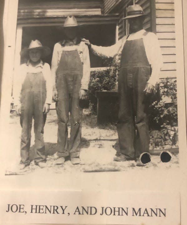 From left to right, siblings Joe and Henry Partin strike poses with their uncle John Mann in Matoaca, Va. This cherished Partin family keepsake hangs in the home of Ruby Partin.