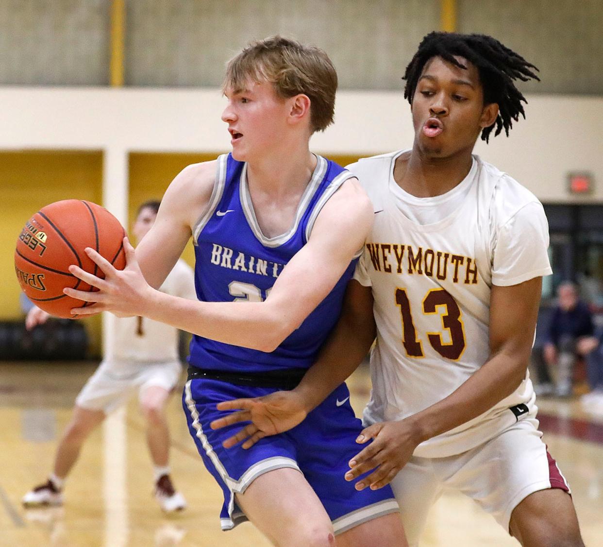 Wamps Owen Kelly makes a pass under pressure from Wildcat Edric Louissaint. 

Weymouth hosts Braintree in their Christmas basketball tournament finale on Friday Dec. 29, 2023