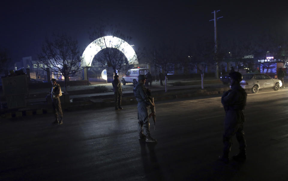 Security forces block the main road at the site of a suicide attack in Kabul, Afghanistan, Nov. 20, 2018. Afghan officials said the suicide bomber targeted a gathering of Muslim religious scholars in Kabul. (AP Photo/Massoud Hossaini)