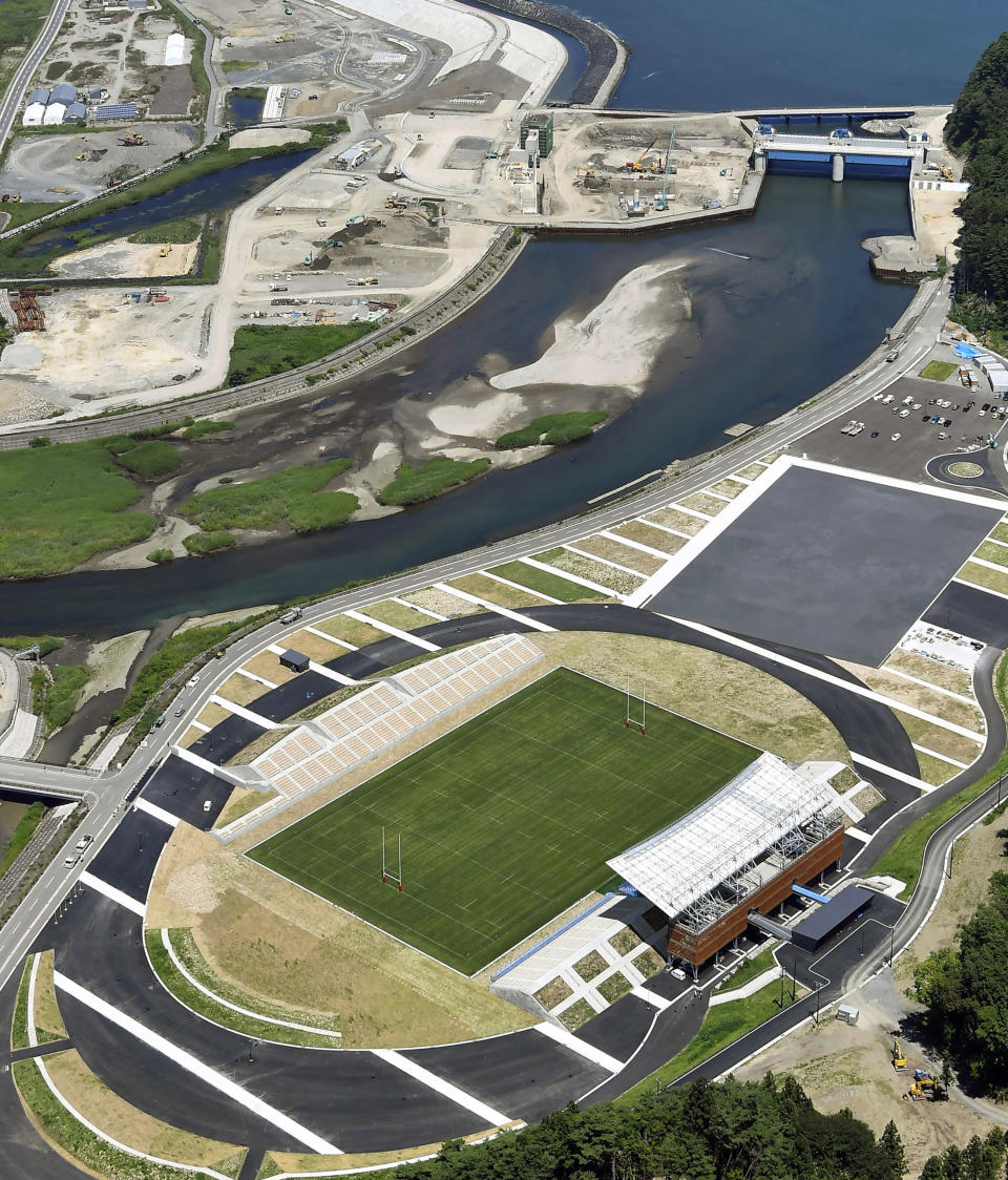 This July 27, 2018, aerial photo, shows Kamaishi Recovery Memorial Stadium in Kamaishi, northern Japan. Japan opened the new stadium Sunday, Aug. 19, 2018, for the 2019 Rugby World Cup on the site of a school that was destroyed by a devastating tsunami in 2011. The 6,000-seat stadium, the only new one built for the World Cup, stands on the former grounds of an elementary school and a junior high school. (Naohiko Hatta/Kyodo News via AP)