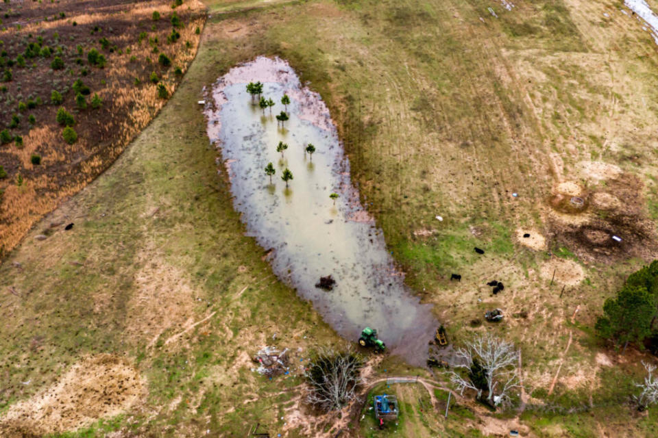 A large puddle on the grounds of a property