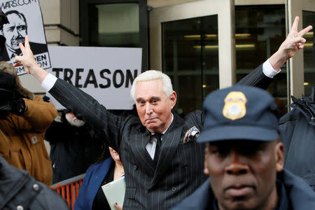 FILE PHOTO: Roger Stone, longtime political ally of U.S. President Donald Trump, flashes a victory gesture as he departs following a status conference in the criminal case against him brought by Special Counsel Robert Mueller at U.S. District Court in Washington, U.S., February 1, 2019. REUTERS/Jim Bourg/Files