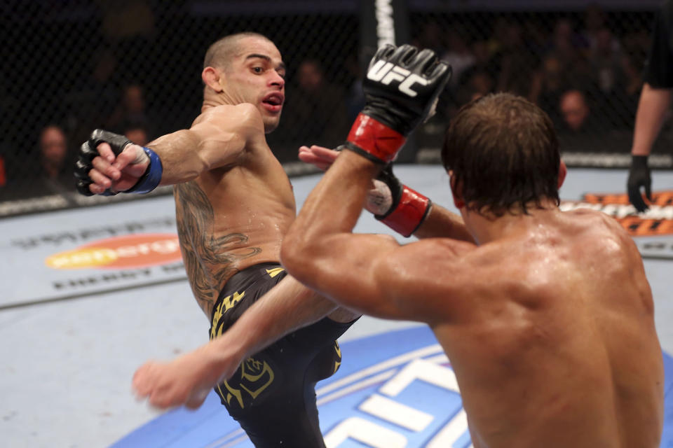 Renan Barao attempts a kick at Urijah Faber during their UFC interim bantamweight championship bout at UFC 149 inside the Scotiabank Saddledome on July 21, 2012 in Calgary, Alberta, Canada. (Photo by Nick Laham/Zuffa LLC/Zuffa LLC via Getty Images)