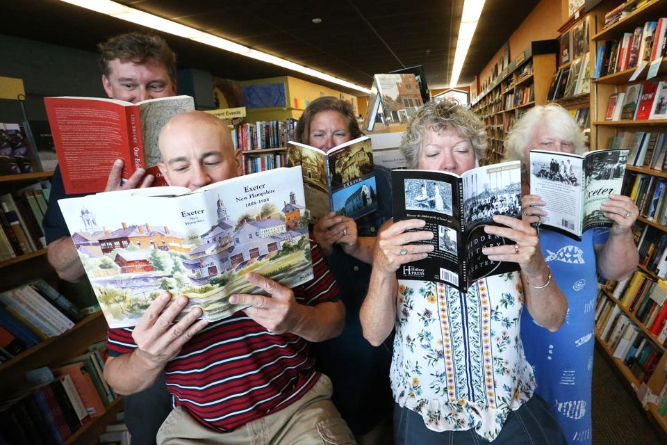 Reading up on Exeter's past and having some fun in Water Street Bookstore are from left shop owner Dan Chartrand, Darren Winham, economic development director, Exeter Chamber of Commerce employees Jennifer Wheeler, Renee Weiland and Bobbi Vandenbulcke.