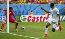 Jerry Bengtson of Honduras (R) watches as his shot is cleared off the line by Switzerland's Ricardo Rodriguez during their 2014 World Cup Group E soccer match at the Amazonia arena in Manaus June 25, 2014. REUTERS/Michael Dalder (BRAZIL - Tags: SOCCER SPORT WORLD CUP)