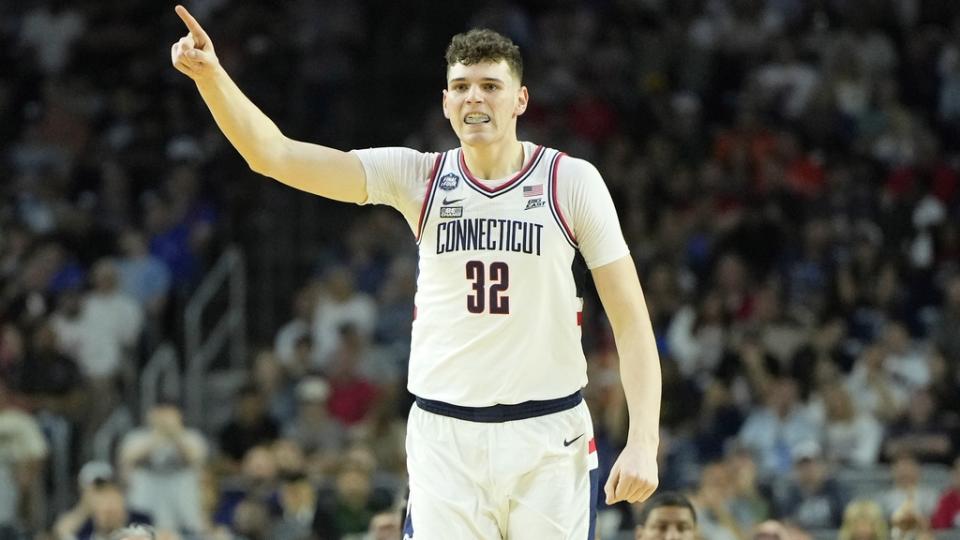 Apr 1, 2023; Houston, TX, USA; Connecticut Huskies center Donovan Clingan (32) reacts after a play against the Miami (Fl) Hurricanes during the first half in the semifinals of the Final Four of the 2023 NCAA Tournament at NRG Stadium.