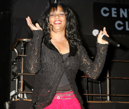 FILE PHOTO: One of the original members of the music group 'Sister Sledge' Joni Sledge performs 'We Are Family' at the CD launch party for the 'We Are Family' CD and DVD All-Star Katrina benefit CD in Los Angeles August 14, 2006. REUTERS/Fred Prouser/File photo