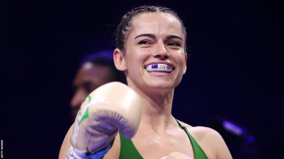 Skye Nicolson smiles with her mouthguard showing in the ring