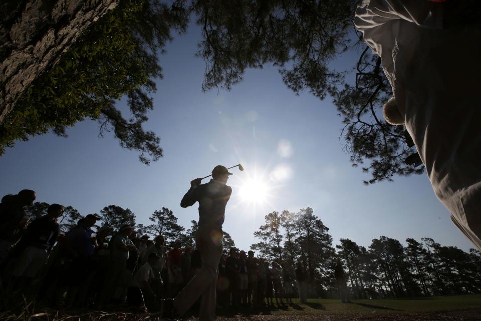 U.S. golfer Matt Kuchar hits a shot on the second hole during the second round of the Masters golf tournament at the Augusta National Golf Club in Augusta, Georgia April 11, 2014. REUTERS/Jim Young (UNITED STATES - Tags: SPORT GOLF)