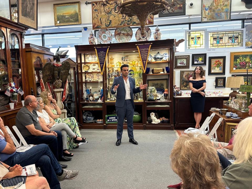 Abe Hamadeh speaking to voters at an antique shop in North Phoenix.