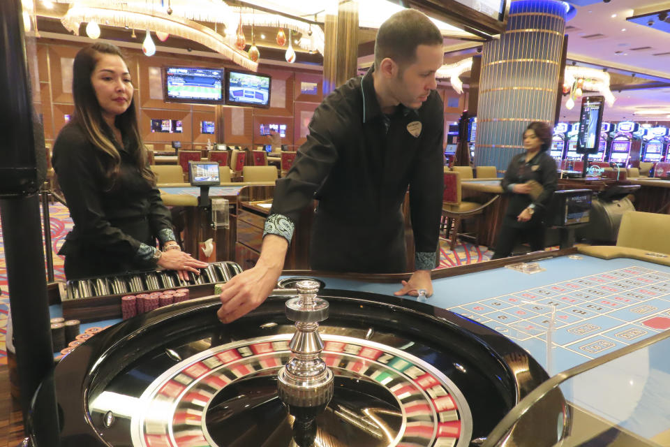 Dealers conduct a game of roulette at the Hard Rock casino in Atlantic City N.J. on May 17, 2023. On Jan, 16, 2023, New Jersey gambling regulators released statistics showing that Atlantic City's casinos, racetracks that accept sports betting and their online partners won nearly $5.8 billion from gamblers in 2023, a new record. But only three of the nine casinos won more from in-person gamblers last year than they did in 2019 before the coronavirus pandemic broke out. (AP Photo/Wayne Parry)