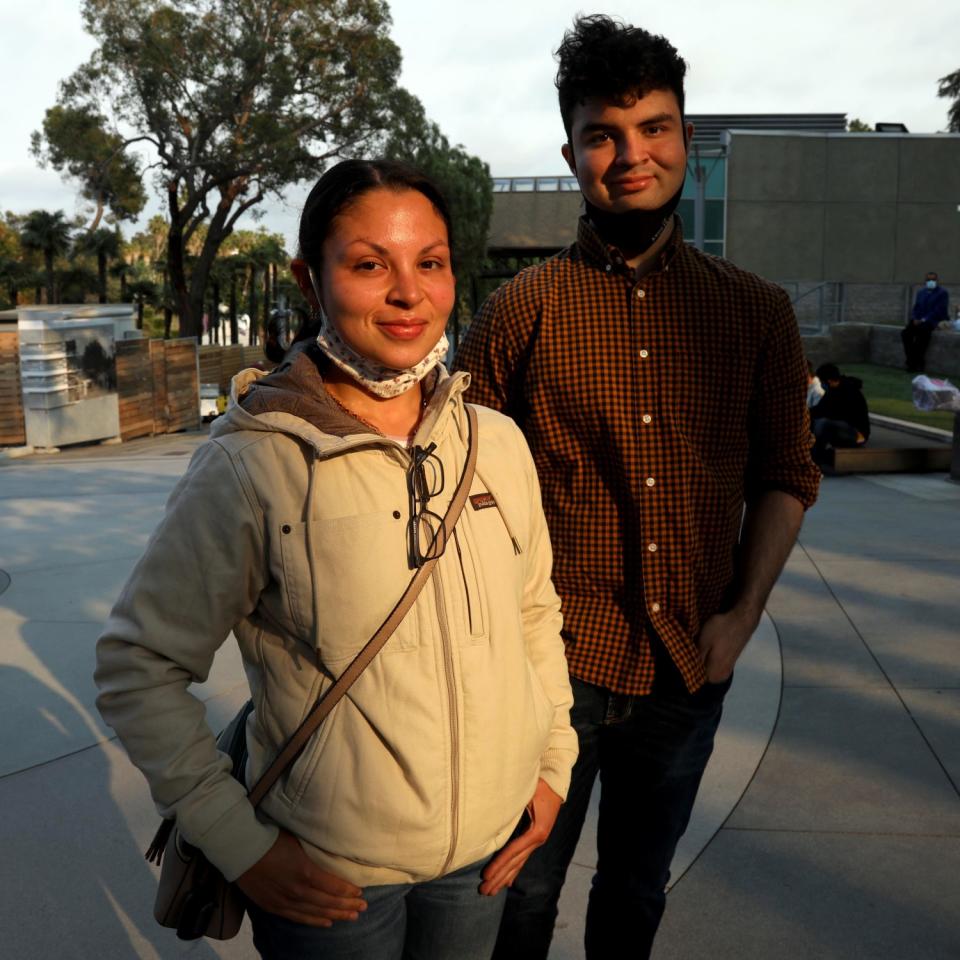 A man and woman pose for a photo.