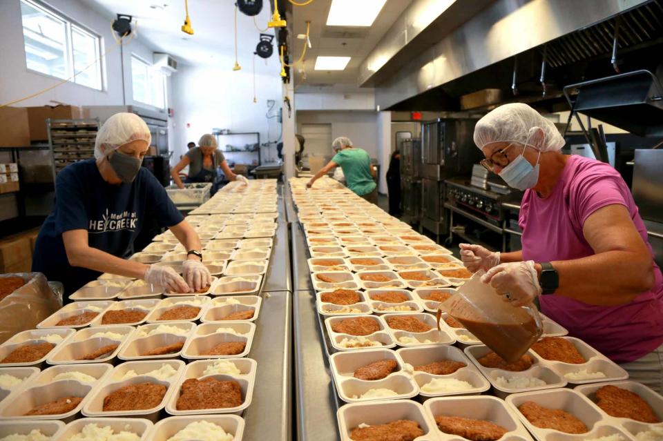 Volunteers prepare meal trays at America's Second Harvest of the Coastal Georgia Food Bank.