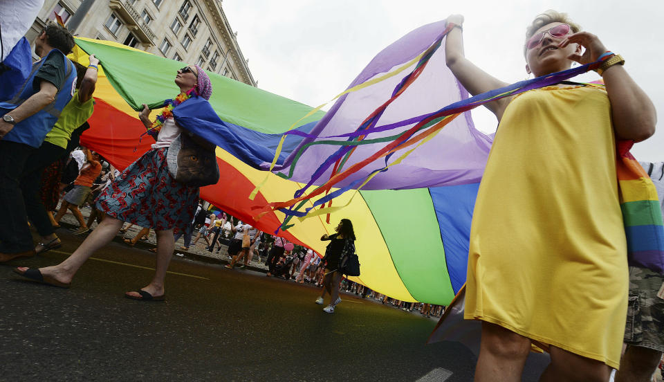 People take part in a gay pride parade in Warsaw, Poland, Saturday, June 8, 2019. The Equality Parade is the largest gay pride parade in central and Eastern Europe. It brought thousands of people to the streets of Warsaw at a time when the LGBT rights movement in Poland is targeted by hate speeches and a government campaign depicting it as a threat to families and society. (AP Photo/Czarek Sokolowski)