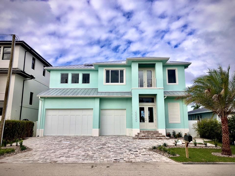 This custom home by Sinclair Custom Homes was just completed on Matlacha. It features modern conveniences and a special tribute.