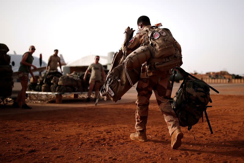 FILE PHOTO: A French soldier leaves with his backpack at the Operational Desert Platform Camp (PfOD) during the Operation Barkhane in Gao