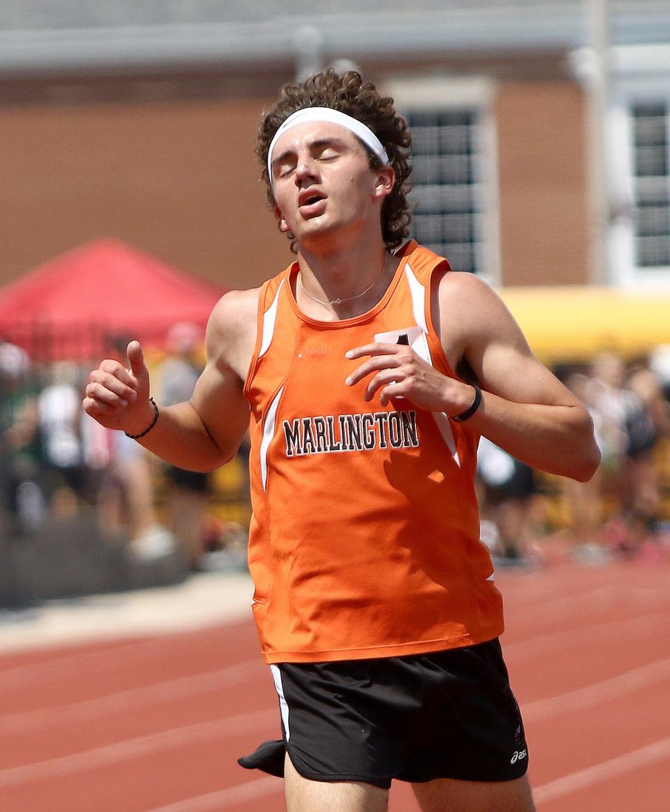 Marlington's Noah Graham crosses the finish line in first place of the boys 3200-meter final at the Division II district track and field finals at Salem Sebo Stadium on Saturday, May 21, 2022.