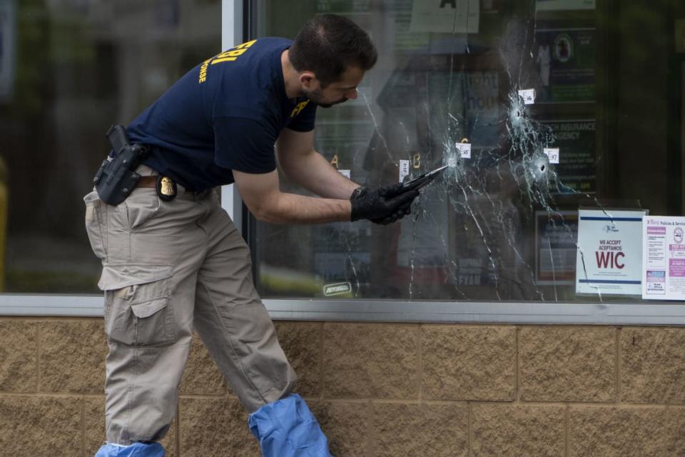 <div class="inline-image__caption"><p>Bullet holes are seen in the window of Tops Friendly Market in Buffalo.</p></div> <div class="inline-image__credit">Kent Nishimura/Los Angeles Times via Getty</div>