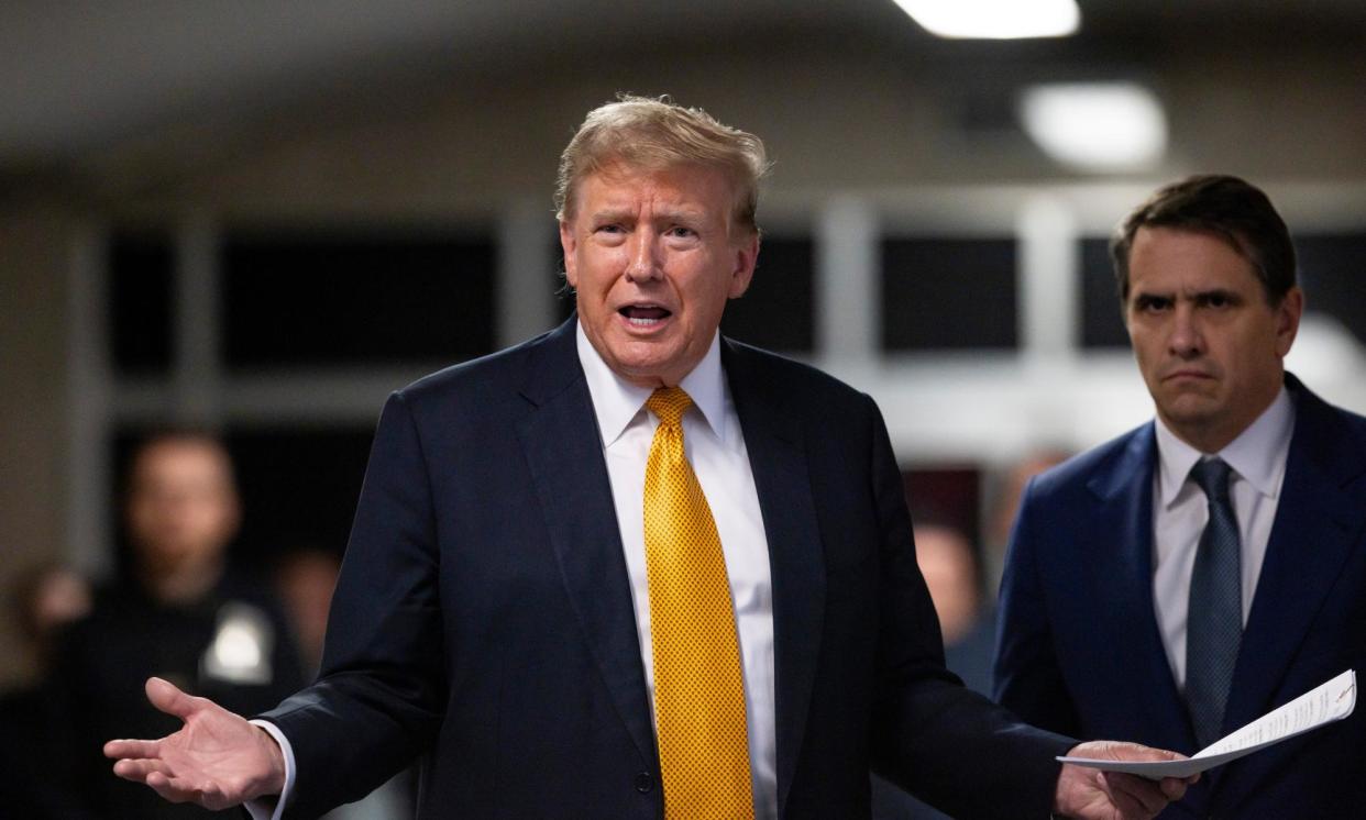 <span>Donald Trump talks to the press while standing with his attorney Todd Blanche at the end of the day at his criminal trial in New York, on 21 May 2024.</span><span>Photograph: Getty Images</span>
