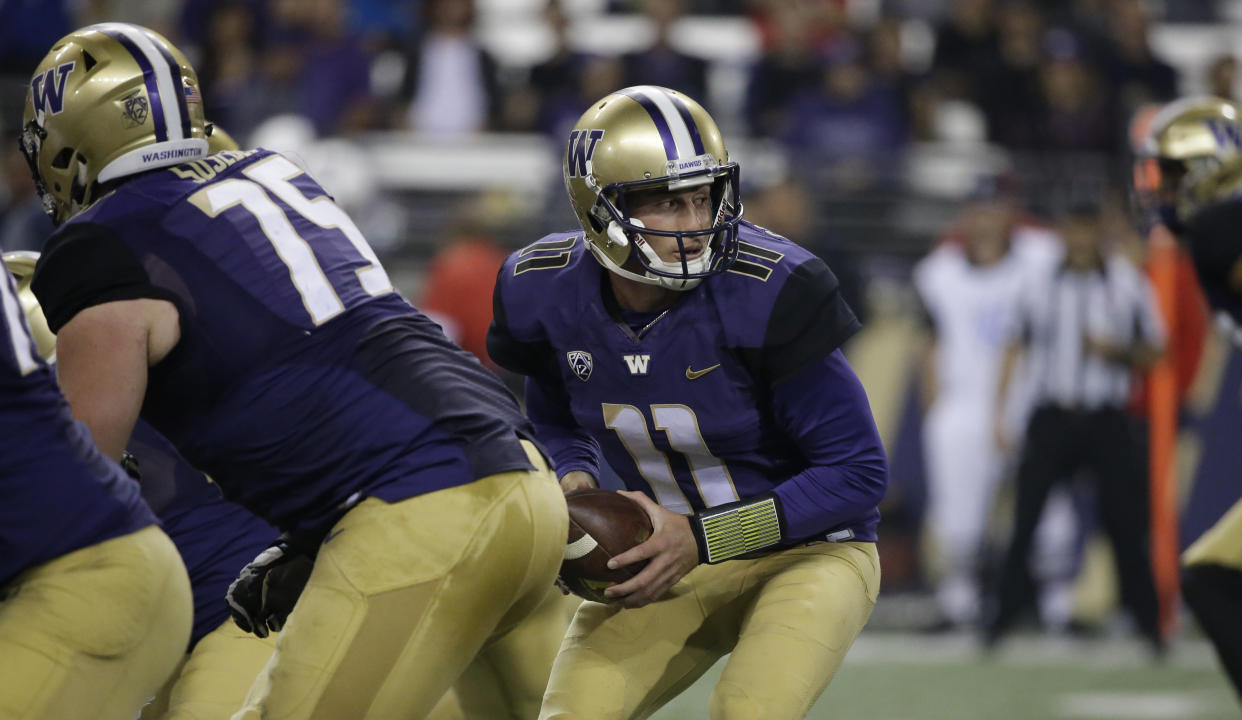 Washington quarterback K.J. Carta-Samuels in action against Fresno State in the second half of an NCAA college football game Saturday, Sept. 16, 2017, in Seattle. Washington won 48-16. (AP Photo/Elaine Thompson)