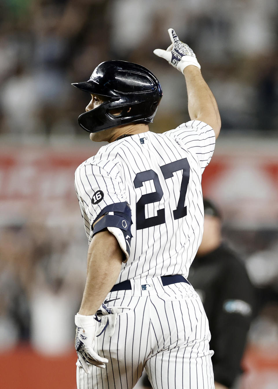 New York Yankees' Giancarlo Stanton reacts after hitting a walkoff single during the 11th inning of a baseball game against the Baltimore Orioles, Friday, Sept. 3, 2021, in New York. (AP Photo/Adam Hunger)