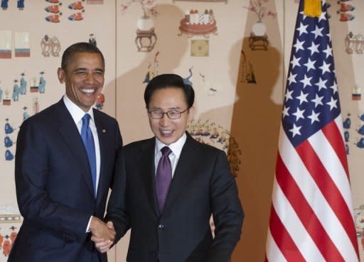 South Korean President Lee Myung-Bak (right) and US President Barack Obama shake hands before meetings at the presidential Blue House in Seoul. Obama said it was unclear who was "calling the shots" in North Korea under its new young leader and stepped up demands for Pyongyang to abort its planned rocket launch