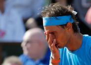 Rafael Nadal of Spain reacts during his men's quarter-final match against Novak Djokovic of Serbia during the French Open tennis tournament at the Roland Garros stadium in Paris, France, June 3, 2015. REUTERS/Vincent Kessler