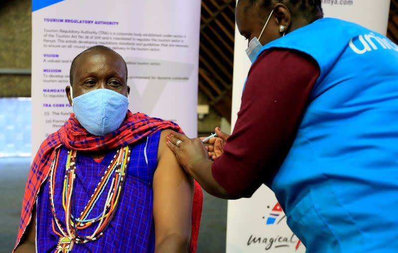 FILE PHOTO: Kenyan tour guide Daniel Ole Kissipan receives the AstraZeneca/Oxford vaccine under the COVAX scheme in Nairobi