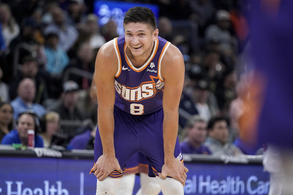 Phoenix Suns guard Grayson Allen (8) smiles after hitting his sixth 3-pointer in during the first quarter of an NBA basketball game in Phoenix, Thursday, March. 7, 2024. (AP Photo/Darryl Webb)