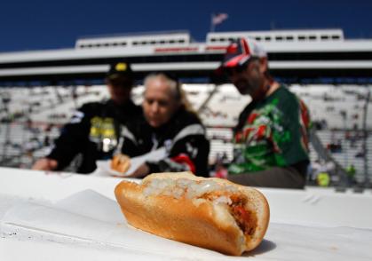 MARTINSVILLE, VA - APRIL 03: Fans look over a Martinsville hot dog, nick named a 