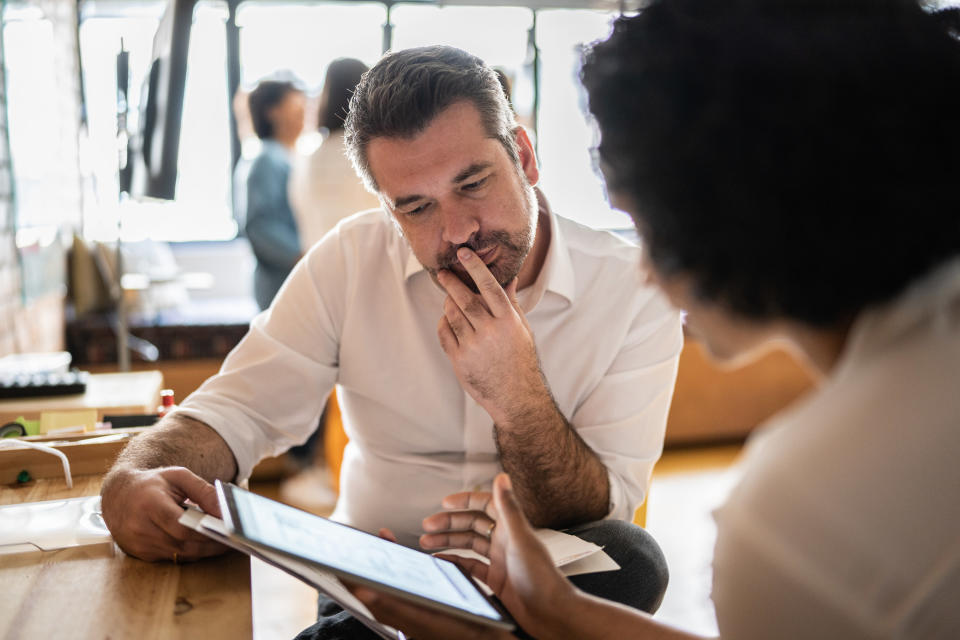 two people talking in an office