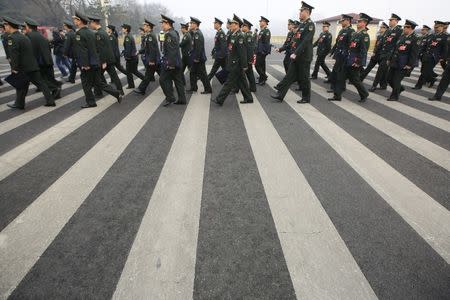 Military delegates arrive at the Great Hall of the People for a meeting ahead of Saturday's opening ceremony of the National People's Congress (NPC), in Beijing, China March 4, 2016. REUTERS/Aly Song