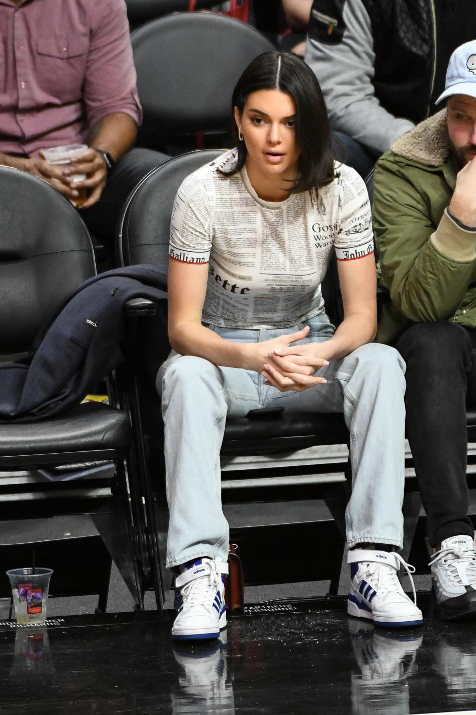 Who: Kendall Jenner<br> What: John Galliano, Adidas shoes<br> Where: At the Los Angeles Clippers game, Los Angeles<br> When: January 24, 2018