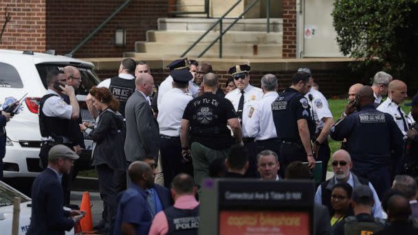 PHOTO: Washington, D.C. Metropolitan police and other law enforcement officers respond to the scene of a reported active shooter near Edmund Burke Middle School in the Cleveland Park neighborhood of Washington, D.C., April 22, 2022.  (Evelyn Hockstein/Reuters)