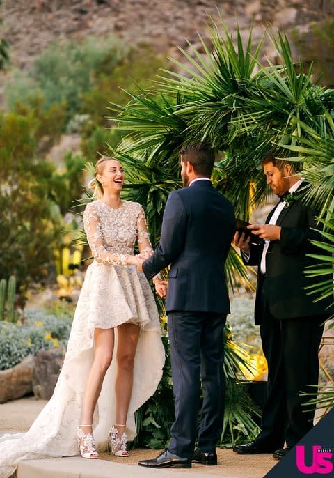 Whitney and Tim share a laugh at the altar.