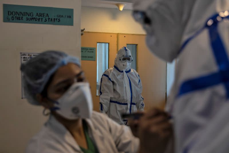 Medical workers treat patients infected with the coronavirus disease (COVID-19) in a hospital in New Delhi