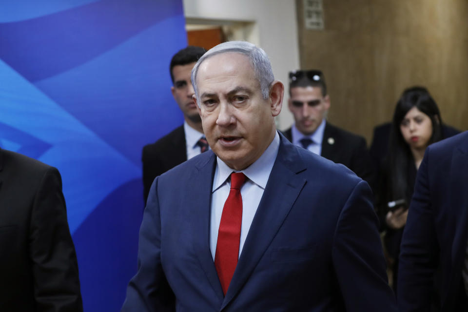 Israeli Prime Minister Benjamin Netanyahu arrives for the weekly cabinet meeting in Jerusalem, Sunday, Jan. 5, 2020. (Ronen Zvulun/Pool via AP)