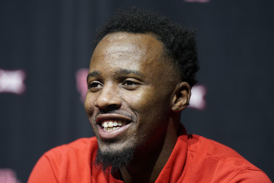 Houston's L.J. Cryer talks to the media during the NCAA college Big 12 men's basketball media day Wednesday, Oct. 18, 2023, in Kansas City, Mo. (AP Photo/Charlie Riedel)