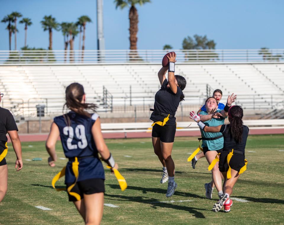 Dana Vejar jumps up for a catch during practice at Palm Desert High School in Palm Desert, Calif., Thursday, Sept. 14, 2023.