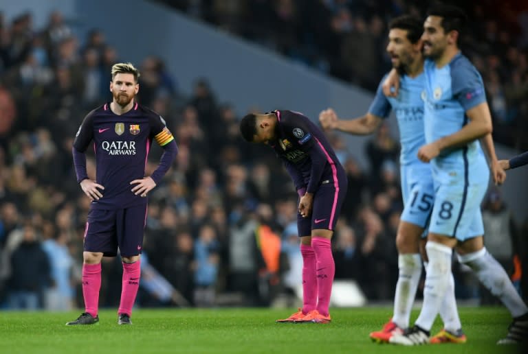 Barcelona's Lionel Messi (L) and Neymar (2L) react as Manchester City's Jesus Navas (2R) and Ilkay Gundogan leave the pitch in Manchester, north west England on November 1, 2016