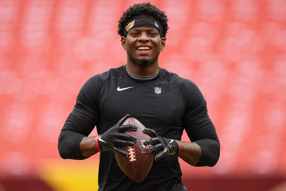 Brian Robinson #8 of the Washington Commanders warms up before the game against the Philadelphia Eagles at FedExField on September 25, 2022 in Landover, Maryland. Robinson was shot twice in the leg during an attempted robbery on August 28, 2022.