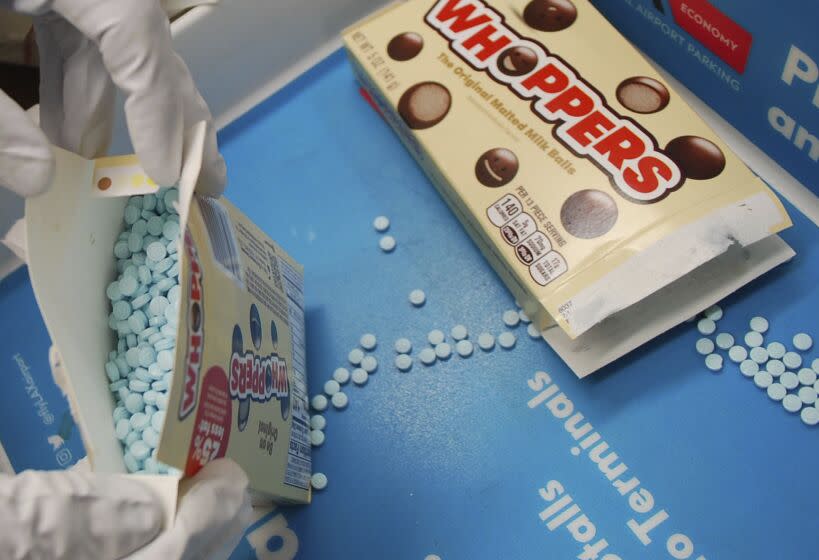 Suspected fentanyl pills in boxes of Whoppers candy.