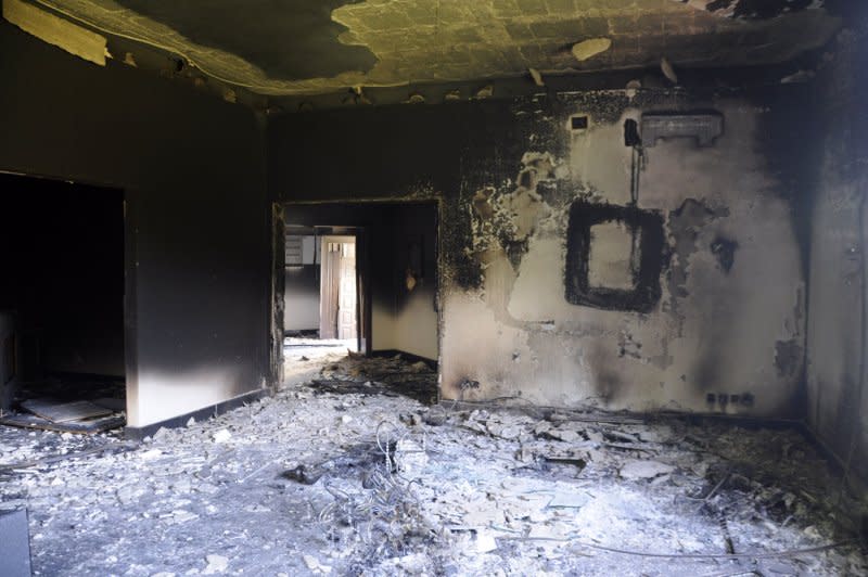 A burnt building is seen at the U.S. Consulate on September 12, 2012, one day after armed men stormed the compound and killed U.S. Ambassador Christopher Stevens and three others in Benghazi, Libya, on September 12, 2012. File Photo by Tariq AL-hun/UPI