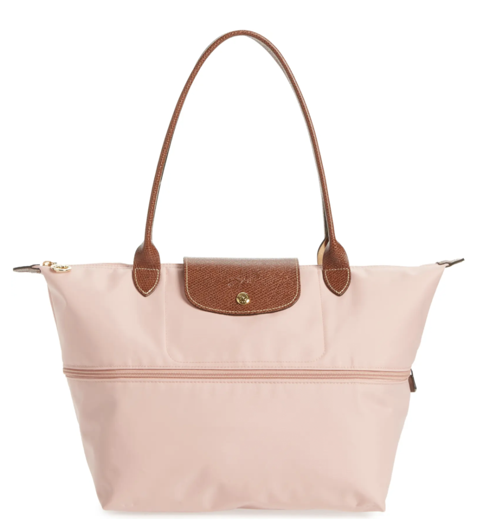 Longchamp Le Pliage Expandable Tote in pinky with brown leather strap (Photo via Nordstrom)