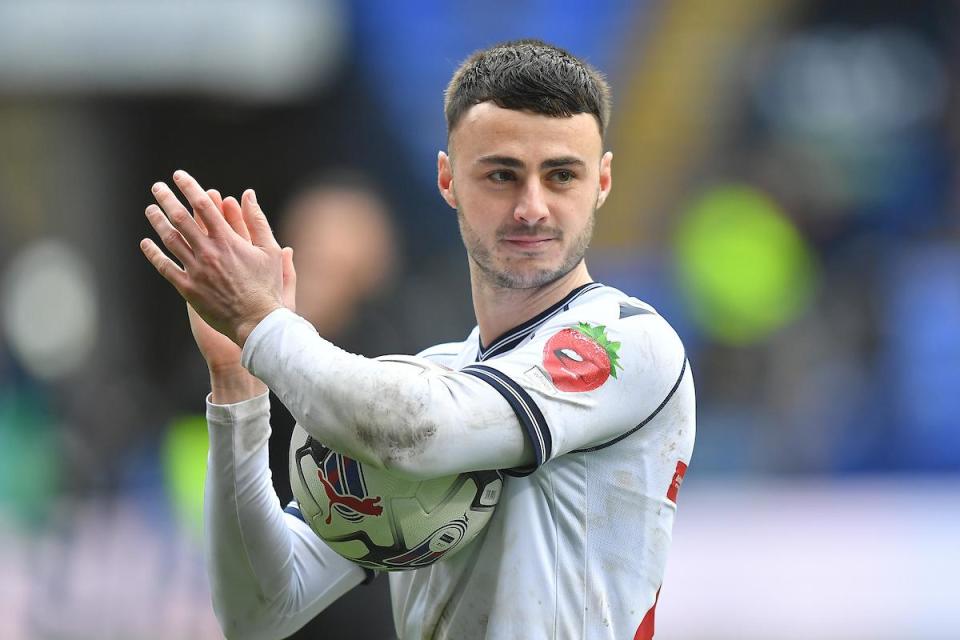 Aaron Collins, clutching the matchball after his hat-trick against Reading <i>(Image: Camerasport)</i>