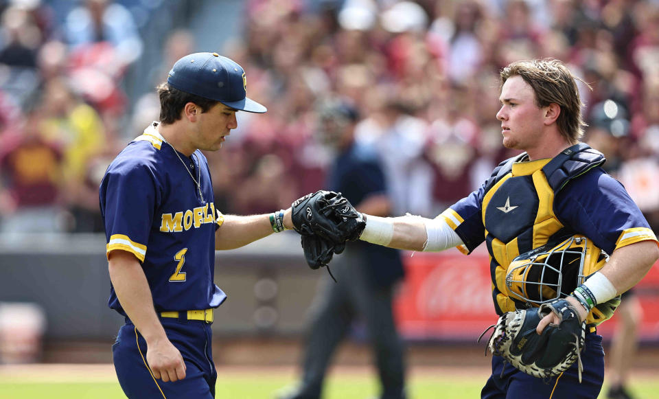 Moeller pitcher Toby Hueber (2) and catcher Nathan Manley (5) react during the Crusaders' 2-0 win over Walsh Jesuit in the OHSAA state baseball Final Four game Thursday, June 8, 2023.