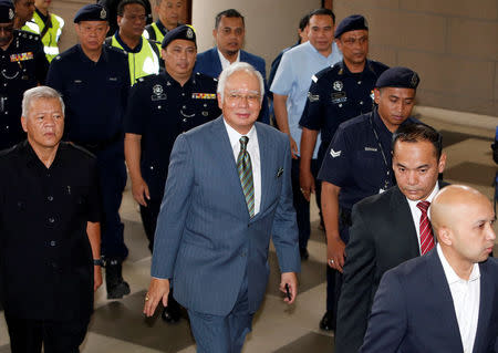 Malaysia's former prime minister Najib Razak arrives in court in Kuala Lumpur, Malaysia August 8, 2018. REUTERS/Lai Seng Sin