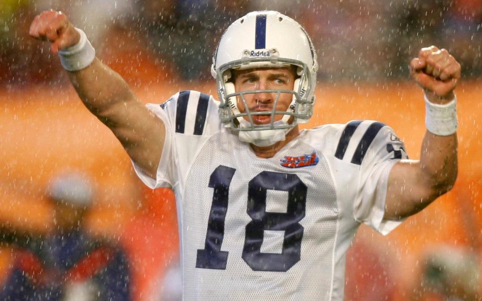 Colts quarterback Manning celebrates second quarter touchdown by Colts' Tillman during the NFL's Super Bowl XLI football game against the Bears in Miami. - REUTERS