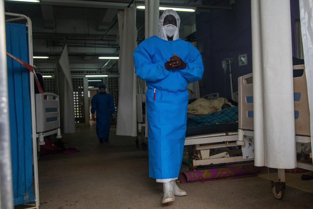 A member of the Ugandan medical staff of the Ebola Treatment Unit stands inside the ward in Personal Protective Equipment (PPE) at Mubende Regional Referral Hospital in Uganda on September 24, 2022. / Credit: BADRU KATUMBA/AFP/Getty