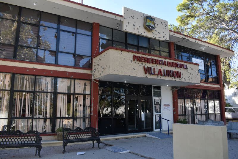 A view of the bullet-riddled facade of the town hall of Villa Union after clashes sparked by suspected cartel gunmen in a northern Mexican town killed 20 people this weekend in Villa Union